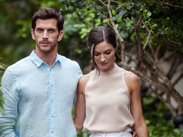 A couple walking in a garden setting