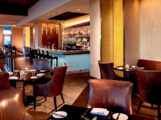 A lounge space with leather chairs
