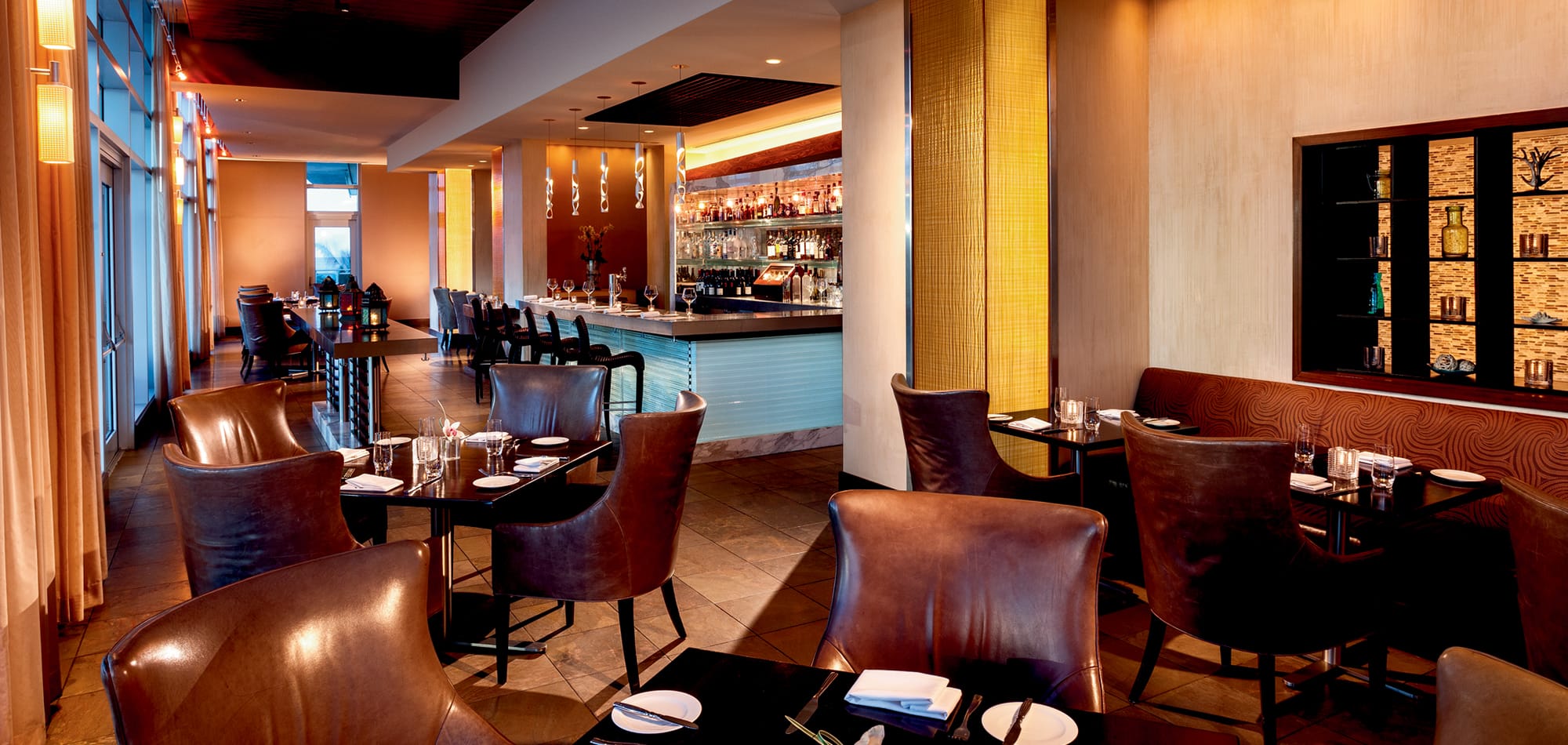 A lounge space with leather chairs