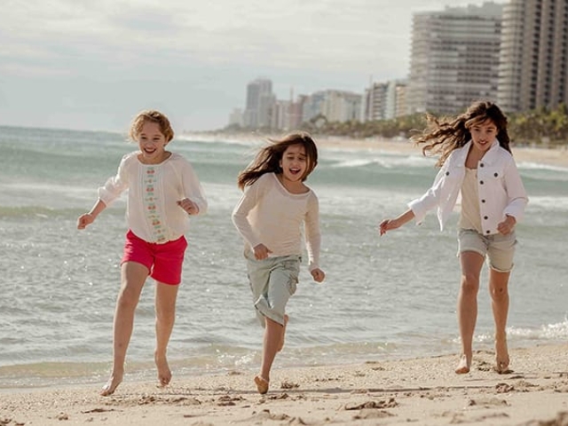 Children running on the beach