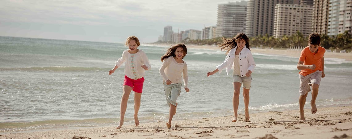 Children running on the beach