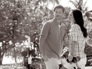 A couple biking on the path