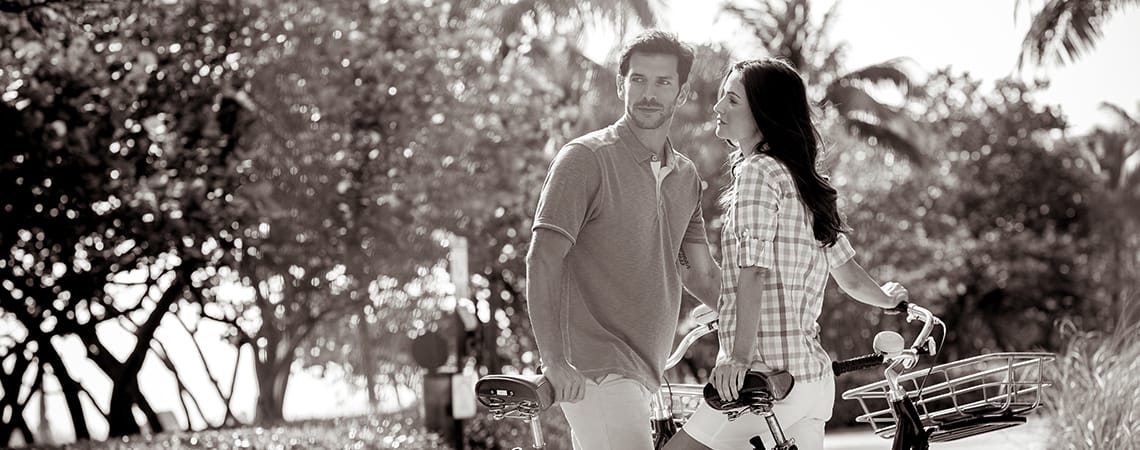 A couple biking on the path