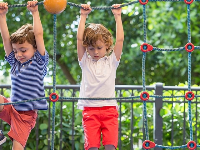 Two kids play on the playground