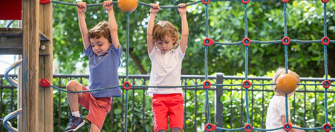 Two kids play on the playground