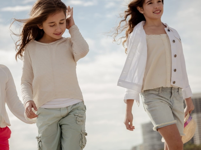 Kids walk down the beach