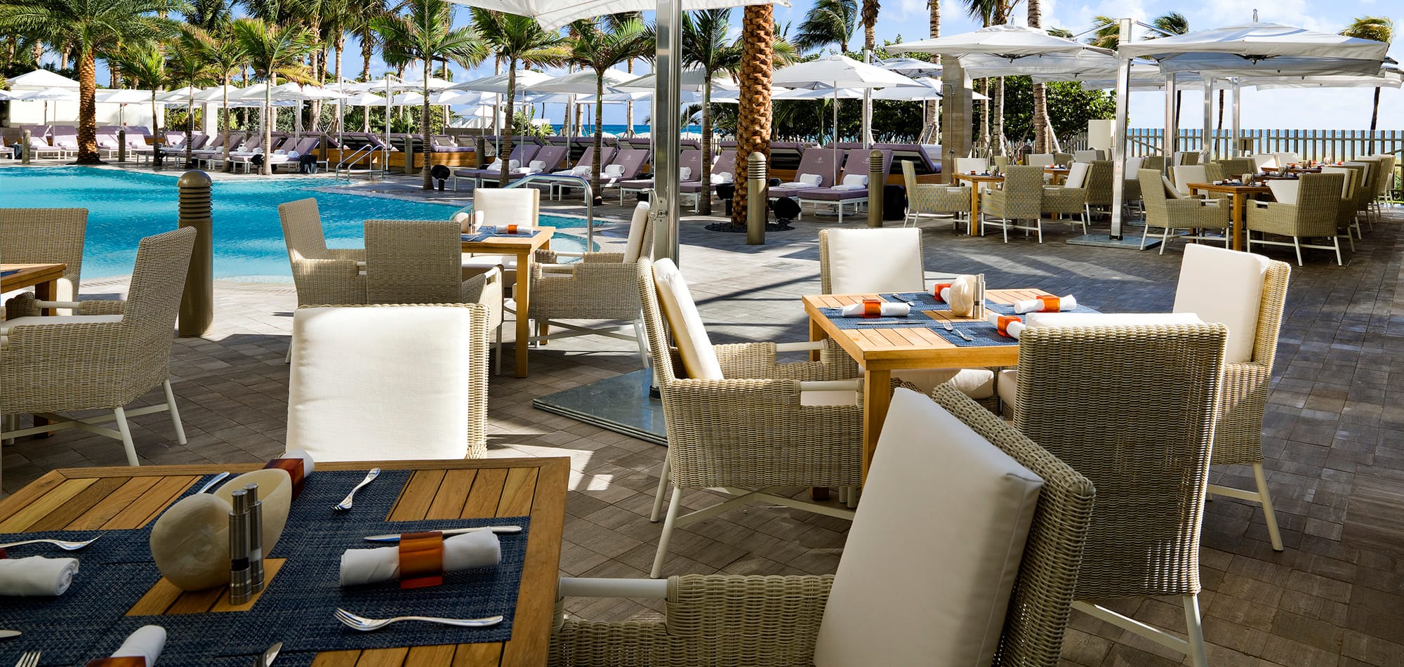 The pool with poolside tables