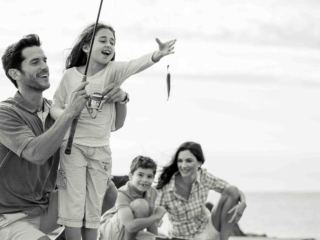 A child fishing with her family