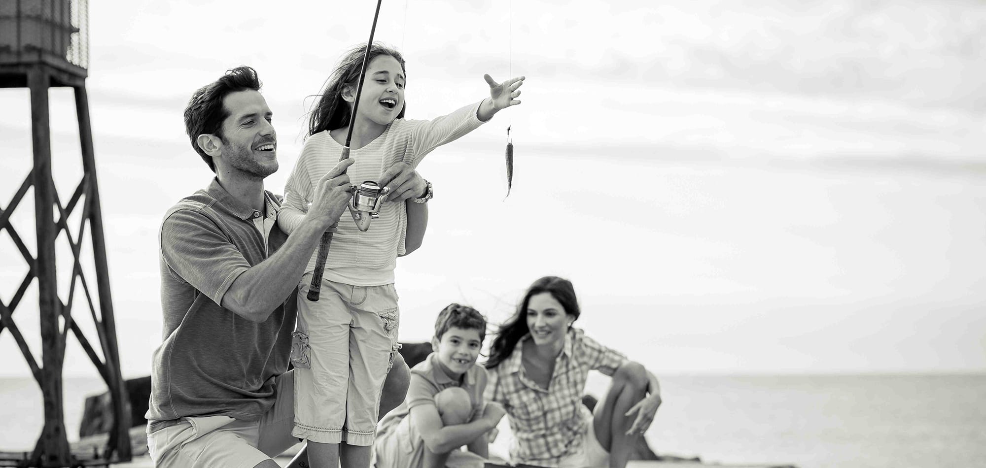 A child fishing with her family