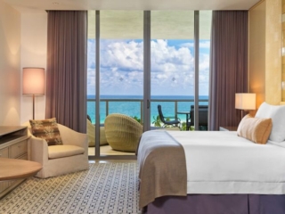 9-BH_Gallery_StRegis_deluxe-ocean-view-bedroom A hotel room