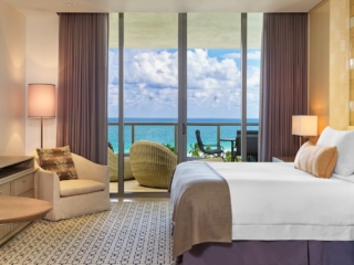 A bedroom with a sea view