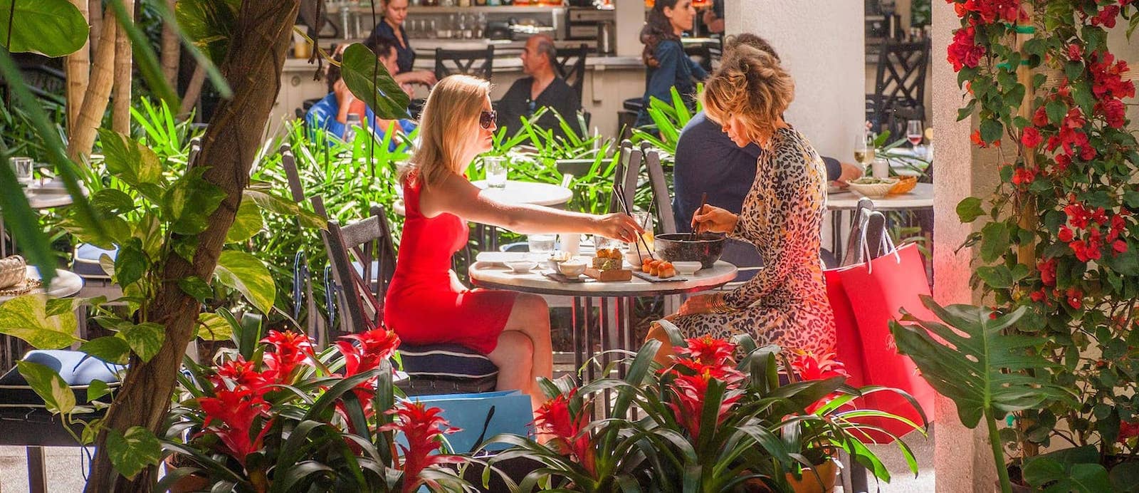 Two women eat lunch outside
