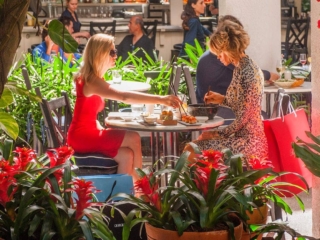 Two women eat lunch