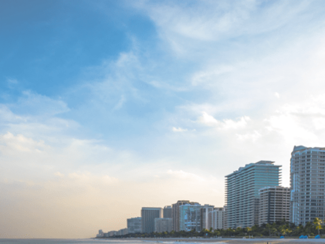 Buildings in the skyline over the beach