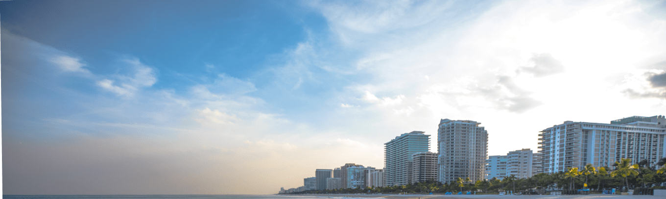 Buildings in the skyline over the beach