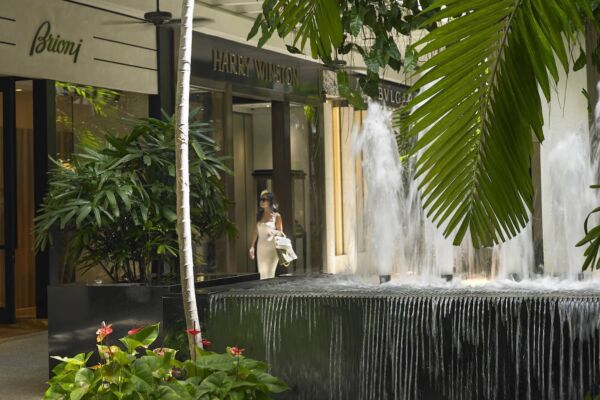 A woman shopping in a tropical setting