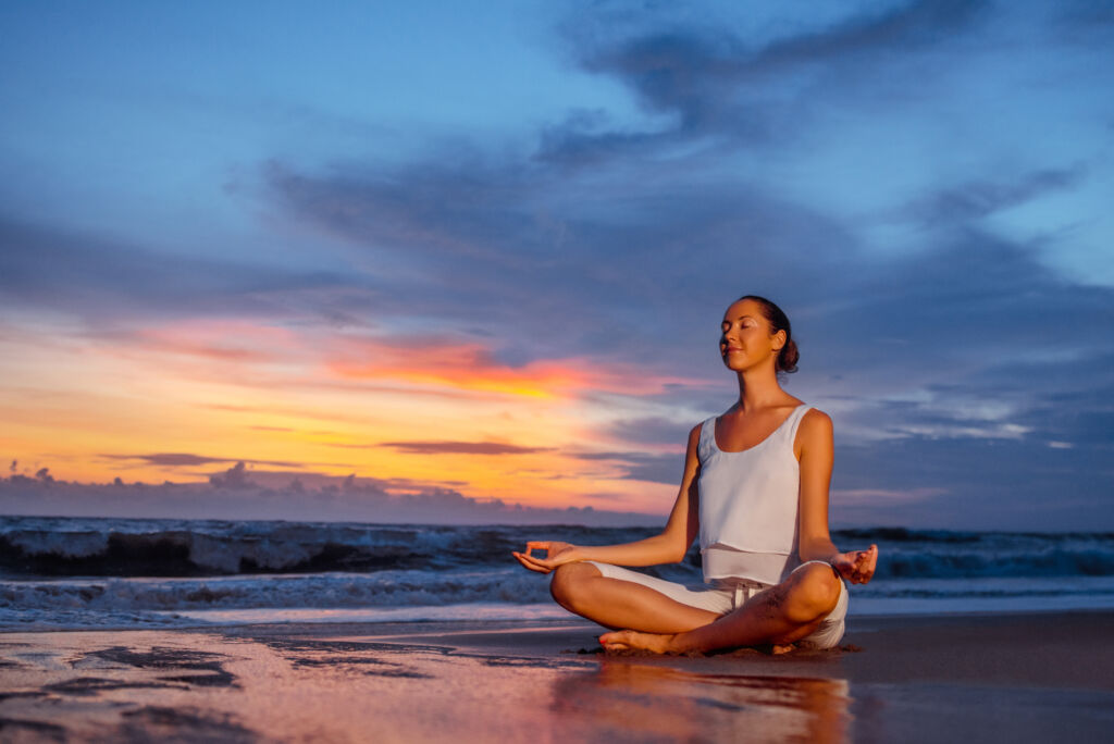 Woman in lotus position outdoors